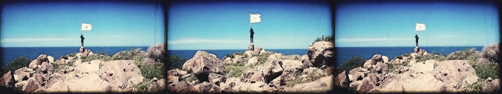 Rupert Jaeger raising the Migrant Republic flag in April 2019 on the Greek Island of Lesbos